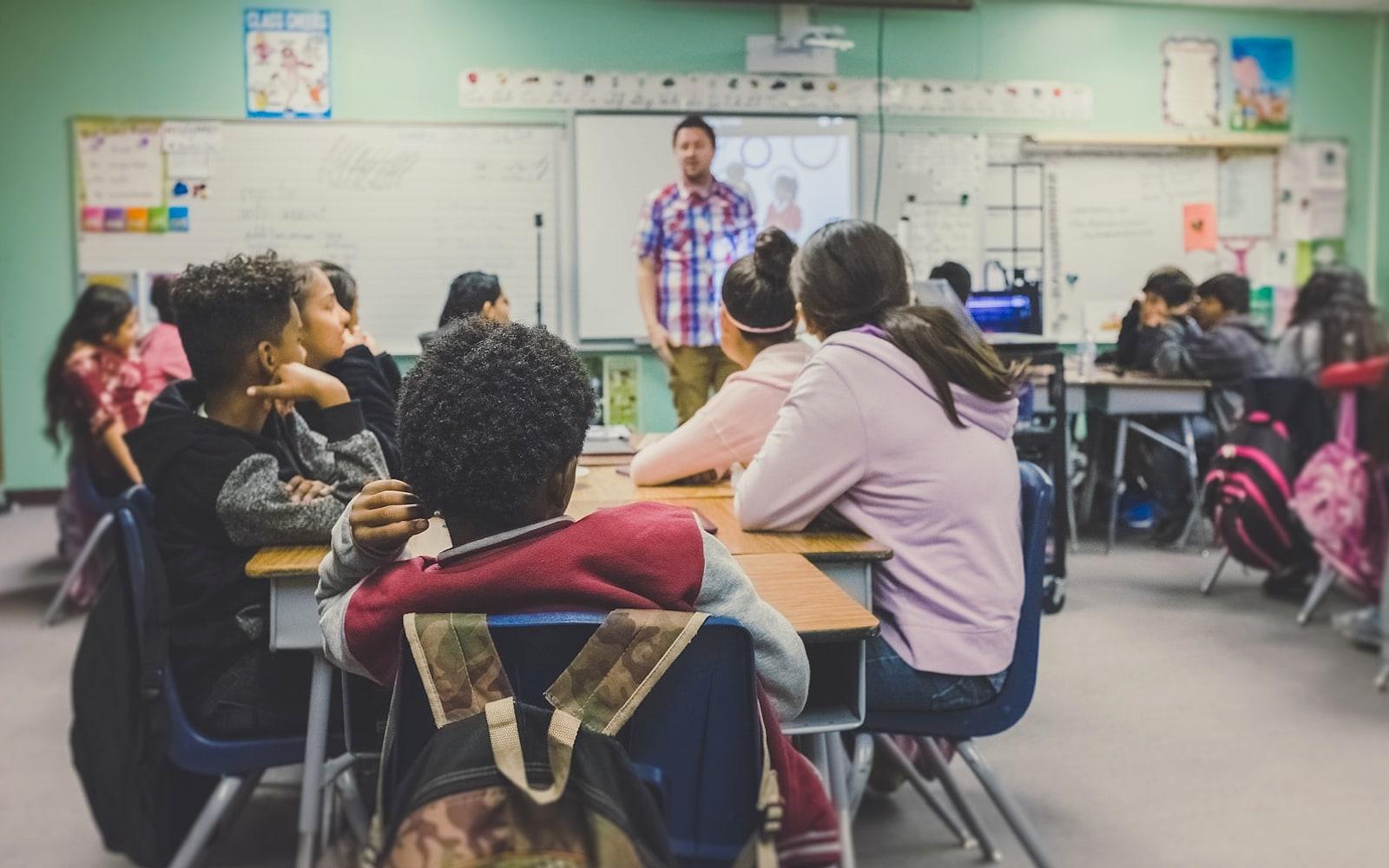 Teacher guiding students in class