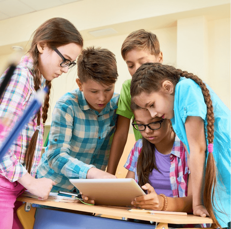 Teacher engaging students who raise their hands in class